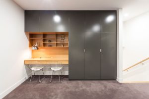 desk timber finish and dark grey wardrobes