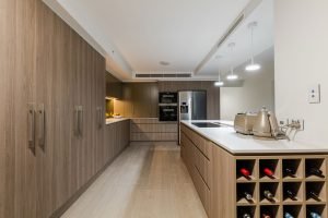 Timber kitchen with Bi-folding doors designed by Cuisine Kitchens