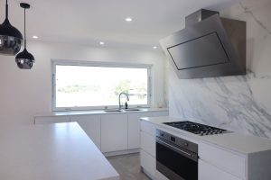2Pac cabinets - Carrara benchtops and porcelain statuario splashback. Kitchen installed by Cuisine - Gold Coast