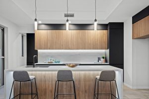 island with white stone benchtop in modern kitchen Gold Coast